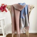 Detailed close-up of a pink floral cashmere-feel scarf draped on a wooden chair - Dandelion Mauve