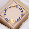 Bracciale occhio greco dorato con perline blu e ciondolo con lettera H traforata elegante - Lettera H