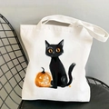 Détail du sac cabas en toile écologique avec imprimé chat noir et citrouille d'Halloween - Chat Noir sur Lanterne Citrouille