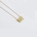 Vintage golden envelope pendant necklace with wave texture on minimalist white background - Envelope (Patterned)