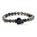 Close-up of natural map stone beaded bracelet with a glittering blue sand penguin charm - Blue Sandstone Map Stone Penguin