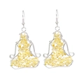 Detail of silver wire-wrapped yoga pose earrings featuring natural yellow crystal stones - Citrine