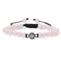 Pink stone beaded bracelet with black woven cord and central projection stone element - Rose Quartz