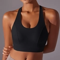 Detail view of black seamless sports bra featuring a U-neck and racerback structure - S / Black