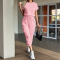 Women's pink two-piece vacation set featuring short sleeve top and elastic waist joggers - Pink