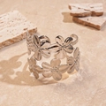Detail of silver metallic double-layer flower open bangle on textured stone background - Silver