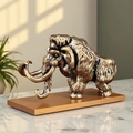 Vintage bronze mammoth statue with detailed fur texture on elegant wooden base - Mammoth