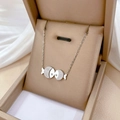 Silver titanium steel choker necklace featuring a kissing fish pendant with cubic zirconia - N312 Kissing Fish Silver