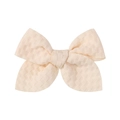 Macro view of textured jacquard fabric texture on a beige handmade 3.3-inch hair bow clip - Cream Beige