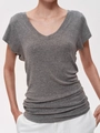 Minimalist grey V-neck T-shirt in tencel wool blend on a model with a clean grey background - S / Gray