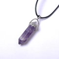 Detailed close-up of a purple amethyst hexagonal crystal point pendant with silver clasp - Purple Crystal