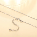 Detailed close-up of a silver water wave chain with lobster clasp and extension link - XL1197 Ingot Link Chain
