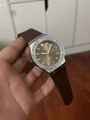 Macro view of crystal-encrusted bezel and textured brown rubber strap on women's watch - Silver Case Coffee Silicone Strap