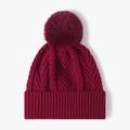 Women's burgundy knit beanie featuring a thick jacquard pattern and fluffy pom-pom top - Burgundy