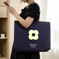 Dark blue non-woven tote bag featuring a white flower logo and Bloom lettering - 25*35*10cm / Bloom Floral