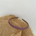 Slim purple fabric headband with a matte leather texture placed on a straw hat - Bean Paste Purple