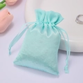 Light blue satin drawstring bag for jewelry storage with elegant silk-like finish - Mint Green