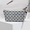 Detail of waterproof Evil Eye makeup bag with blue patterned fabric and black zipper - Classic Blue White Black