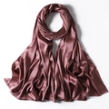 Close-up detail of smooth satin silk scarf in dusty rose pink with elegant glossy texture - Rose Brown