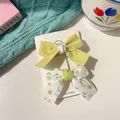 Two-piece set of girls' bow hair clips in solid grass green and floral pattern - Green Patchwork Bow Set