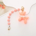 Pink resin balloon dog keychain with pearl and pink bead chain on a white background - Pink Balloon Dog