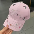 Pink baseball cap featuring rhinestone floral patterns and colorful butterfly patches - Adult One Size (Adjustable) / Pink