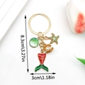Detailed view of ocean theme keychain with starfish, shell and mermaid tail dimensions - Enamel Green Ocean Mermaid Starfish Shell Keychain-ER595