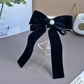 Detail of black velvet bow hair clip featuring a rose, pearl, and gold bead tassel - Velvet Rose Pearl Tassel - Black