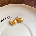 Macro shot of matte gold drop earrings on a ceramic tray with fine brushed texture - Water Drop Brushed Style / Gold (Real Gold Plated)