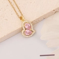 Detail of gold heart pendant with pink pear-cut crystals and sparkling zircon accents - Heart Waterdrop
