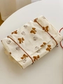 Dettaglio della stampa a orsetto su beauty case in tessuto crema a pois arancio - Orsetto con Bavaglino Roll-up