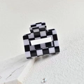 Macro shot of square black and white checkered hair claw clip in polished acetate - 5cm Square Claw Clip / Black/White 5cm Grid Clip