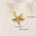 Macro view of gold starfish pendant with texture details on sand, 16.9mm x 14.9mm size - A0570 Textured Starfish