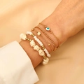 Makro-Detail des böhmischen Evil-Eye-Armband-Sets mit weißen Perlen und Goldkette - 05 Weiß (5 Stk.) (10726)