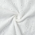 Macro shot of white cotton eyelet embroidery fabric with delicate floral lace patterns - S / White