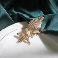 Golden starfish and shell hair clip with white pearl detail on green silk background - 6cm Large Shell Star Pearl Clip