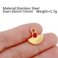 Fan-shaped stainless steel pendant with red natural stone in 18K gold finish on fingertip - DY789-1 Fan-shaped Red Stone