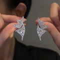 Detail shot of silver butterfly zircon earrings held to show fine craftsmanship and shine - Silver Butterfly (5#)