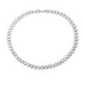 Macro shot of silver tennis necklace with oval-cut zircons and secure clasp closure - Necklace / White Gold