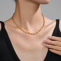 Polished gold PVD coated stainless steel pig nose chain necklace on model - Gold Single Coffee Bean Link Necklace