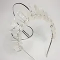 Detailed view of handmade crystal crown headband with silver wire wrapping on metal base - White Crystal with Silver Wire