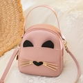 Pink cat-shaped mini backpack for women featuring cute golden heart and whisker accents - Pink