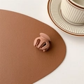 Close-up of matte clay brown mini hair claw clip on a minimalist textured table - Matte Bean Paste (Medium Approx. 3.5cm)