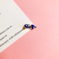 Macro detail of blue enamel and gold metal ice cream cone pendants on pink background - 12# Blueberry Heart Ice Cream