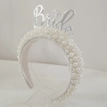 White bridal headband featuring cluster pearls and a silver metal Bride lettering detail - Silver Letters BRIDE (Series 3-5)