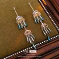 Vintage-Ohrringe mit Blumenperlen, Quasten und blaugrauen Perlen in Goldoptik - Hohler Windglocken-Quastenstil / Silbernadel-Windglocken Wassertropfen