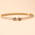 Slim gold PU leather belt for women featuring a double fish metal buckle with grey rhinestones - Fish Shape Buckle (19245) / Gold