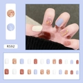 Macro detail of R592 light blue and glitter press-on nail kit with 24 pieces set - R592 Treasure Sequins