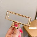 Minimalist gold alloy hair claw clip with 7cm rectangular hollow geometric frame design - Square Claw Clip 7cm