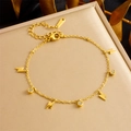Detailed shot of gold lightning and round crystal charms on a minimalist metal bracelet - Lightning Style (B1476)